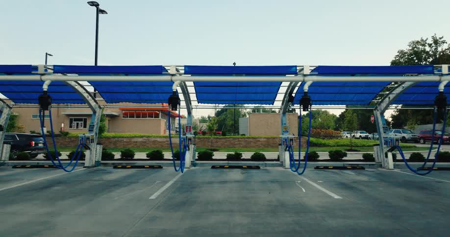 Covered area with hoses and equipment for manual car washing