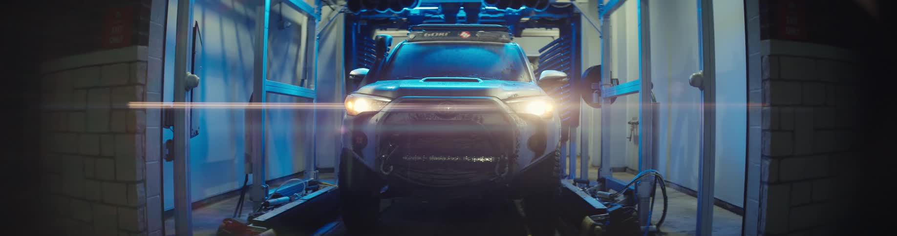 Vehicle moving through an automatic car wash system