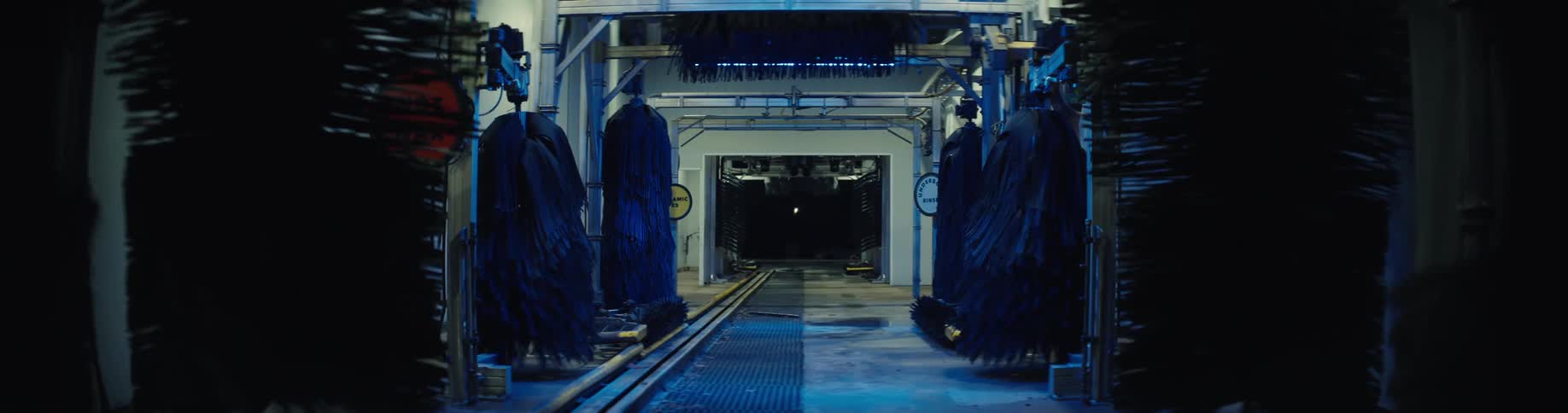 Interior of an automatic car wash system with aligned rotating brushes