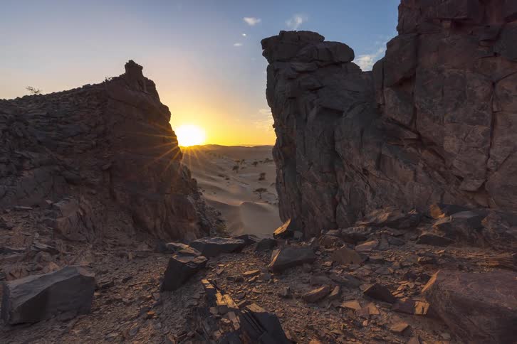 A view of a sunset over a desert