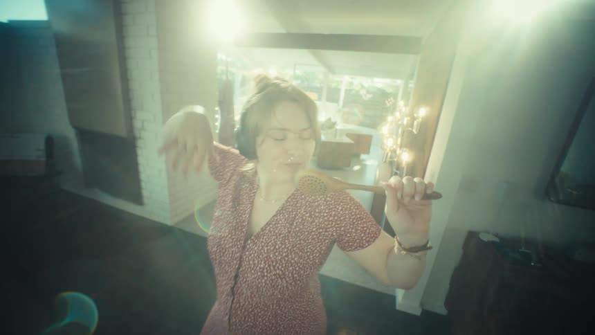 A woman singing in a room