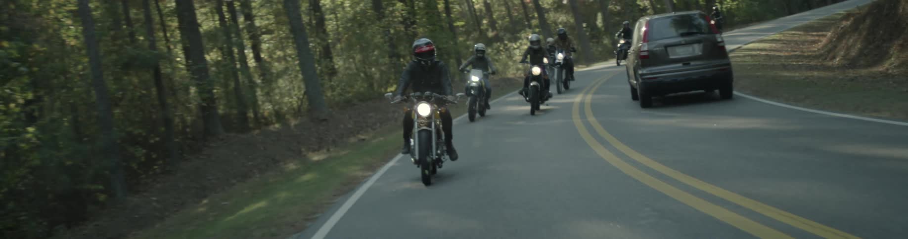 Group of motorcycles riding on the road
