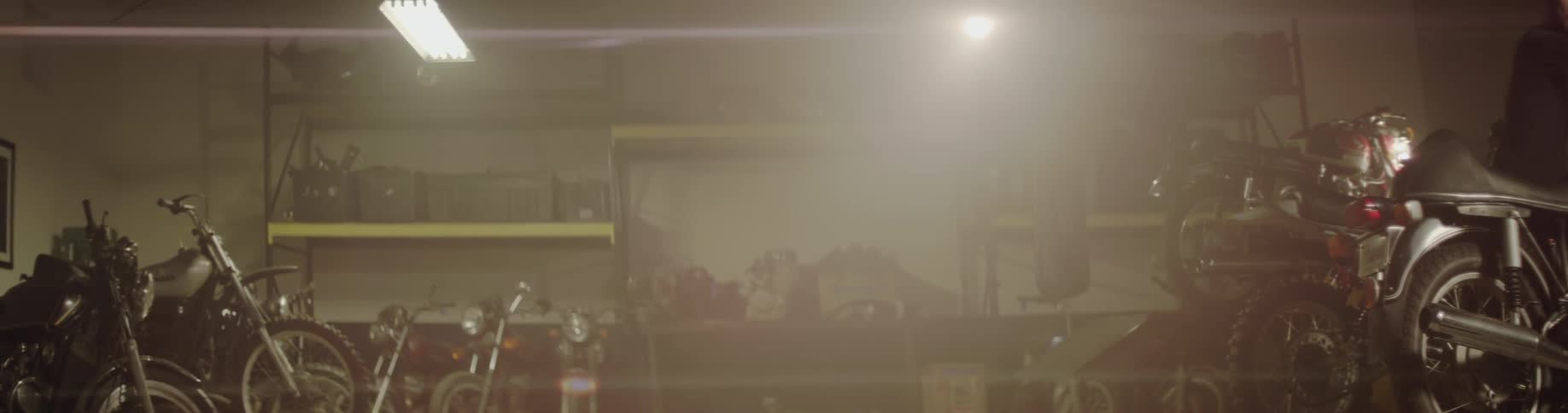 A light shines from the ceiling of a garage