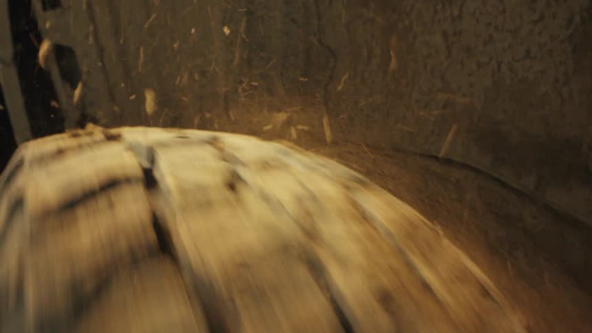 Suv tire spins rapidly throwing dirt and dust particles