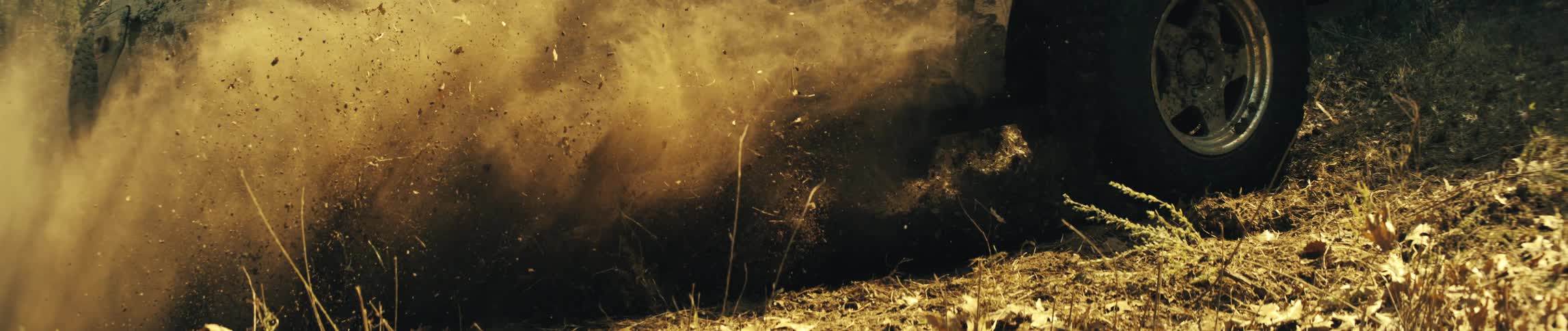 A vehicle driving off road in the dirt