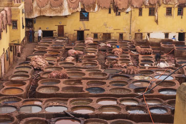A group of people working in a factory outdoors