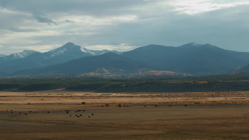 A view of a landscape with mountains in the distance