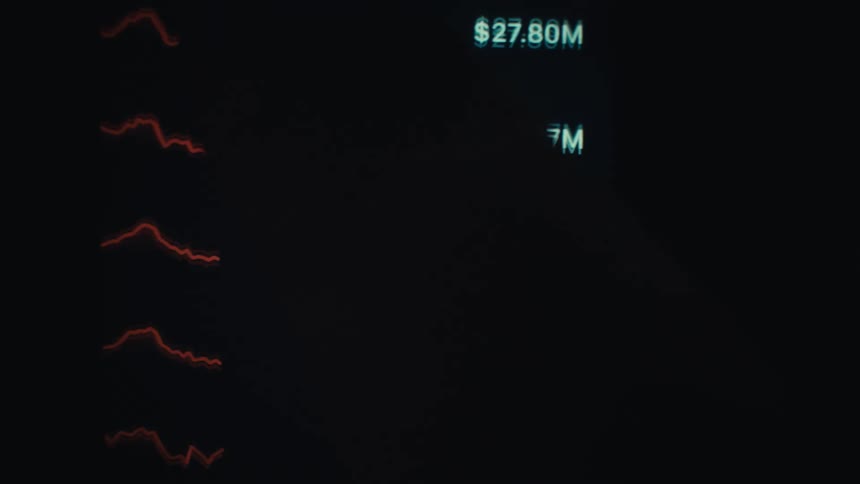 Glowing green and red digital line graphs display financial data on a dark background