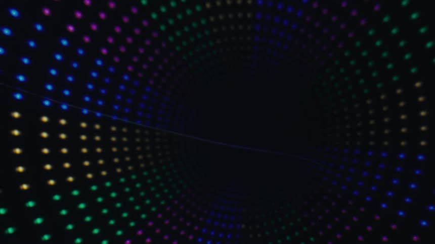 Circle formations with orbs of glowing colored lights in the darkness