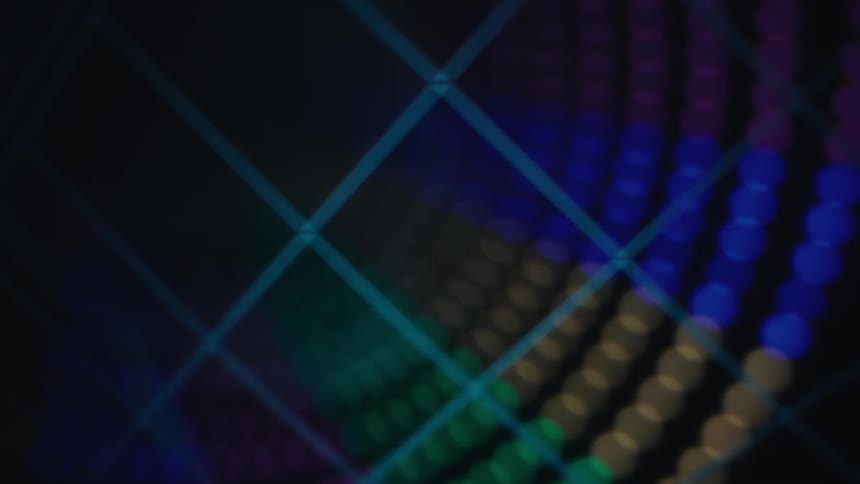 Glowing colored orbs and blue lines move across the darkness
