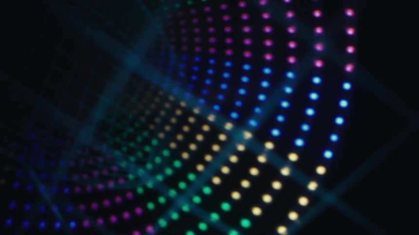 Abstract pattern of colored dots forming luminous waves on a dark background