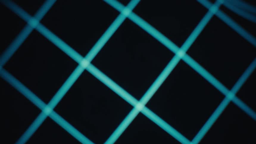 Blurred glowing blue grid lights forming an abstract futuristic pattern against a dark background