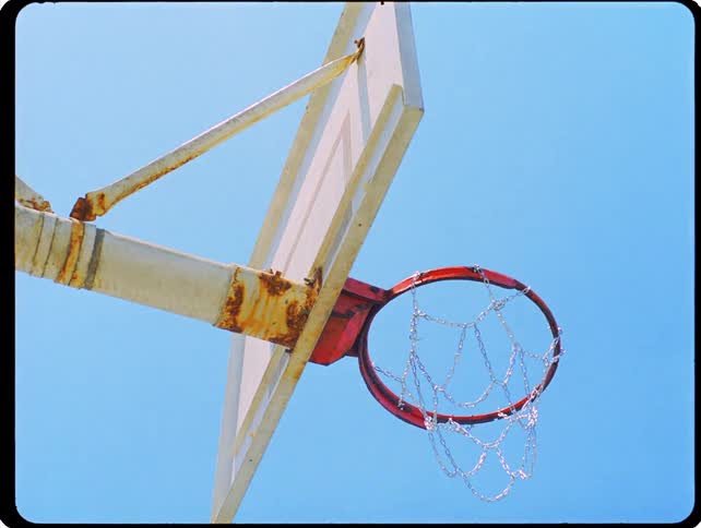 Clear sky is over the basketball hoop
