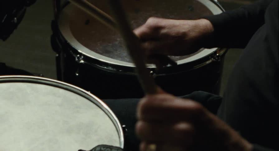 Close up of an old man drumming