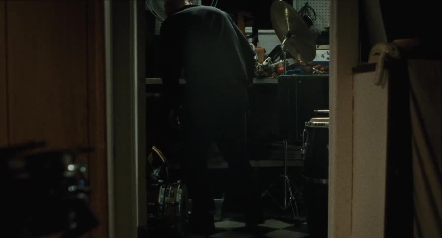 An old man goes through an old closet of things