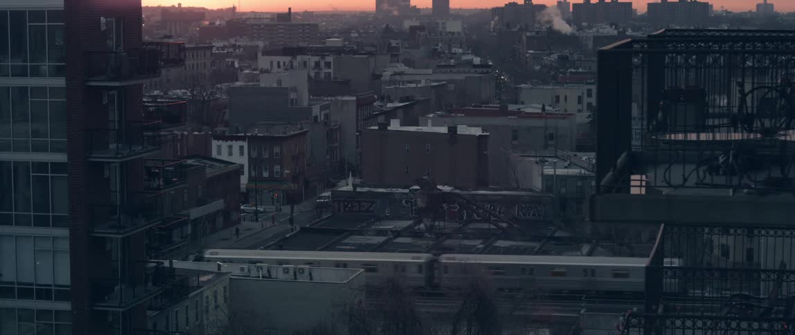 View of the rooftops as a train passes by