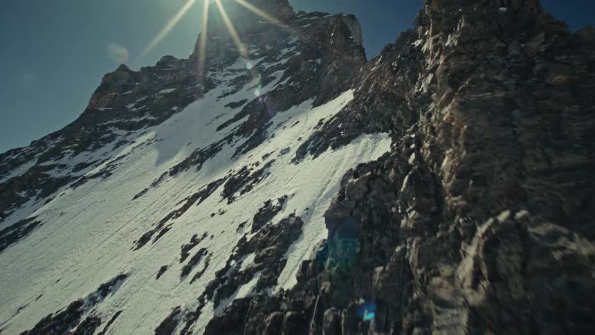 An aerial view of a mountain covered in snow