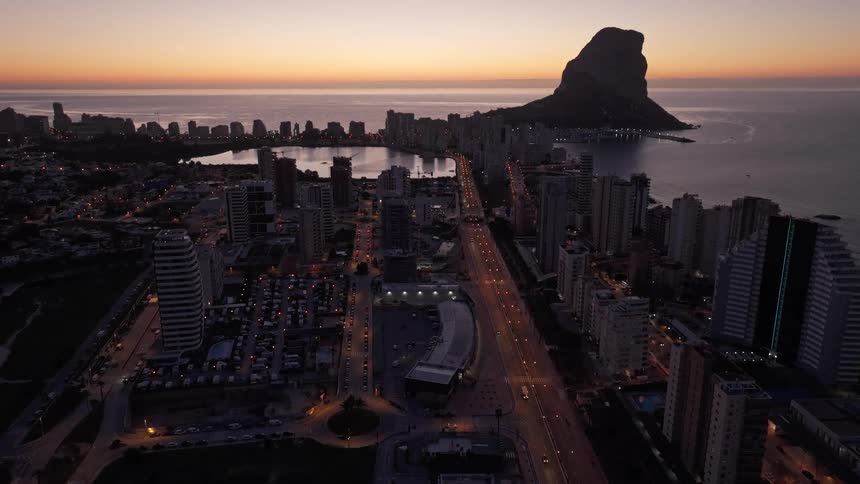 An aerial view of a city at dusk