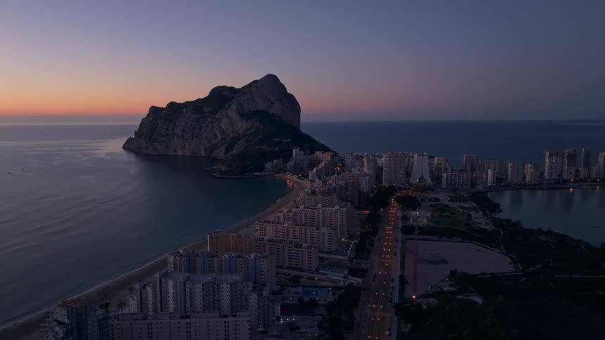An aerial view of a city at dusk