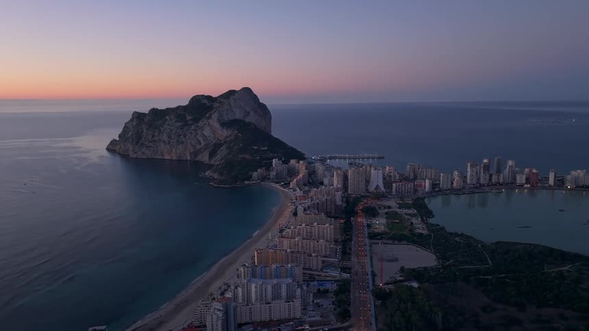 Coastal city with rocky mountain by the sea