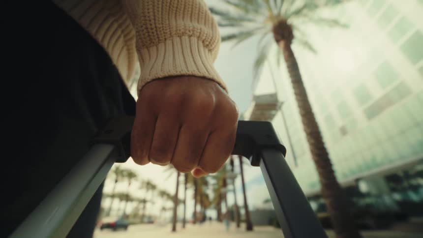 A man walking with a suitcase