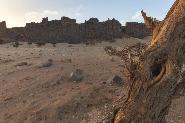 Landscape of the red tadrart mountain rock formations in the sahara desert