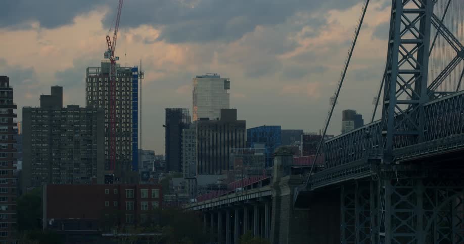 Bridge leading into a city at dawn