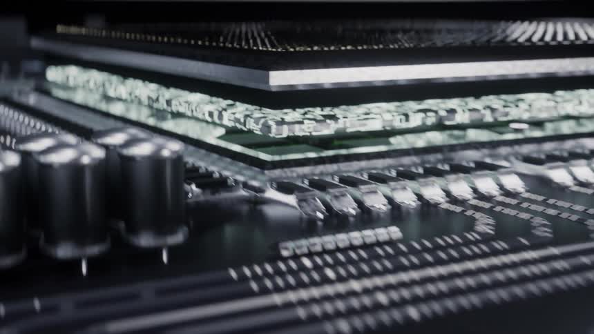 Lights glow on circuits and computer components on a motherboard
