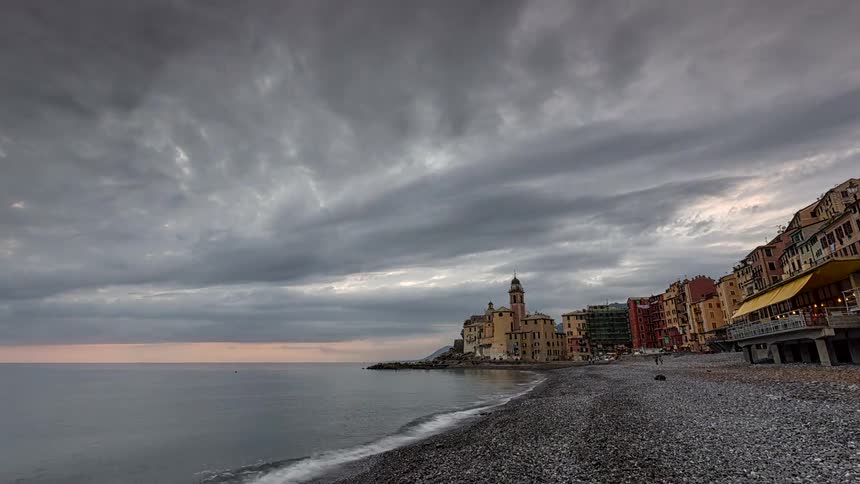 A view of a beach next to a city