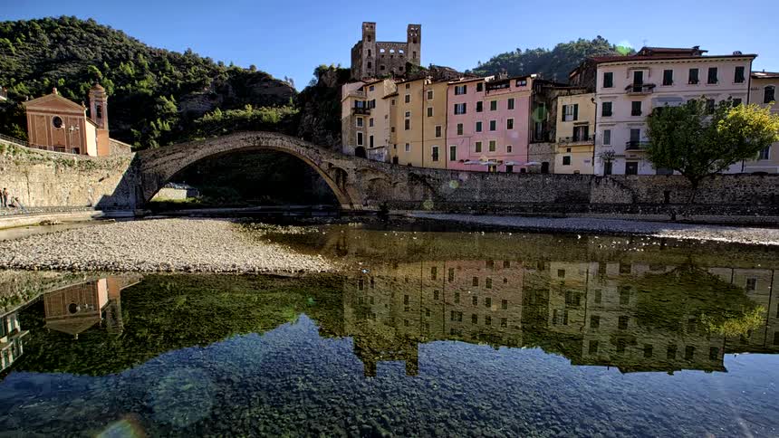 The river cutting through a rural mountain town is almost dried up