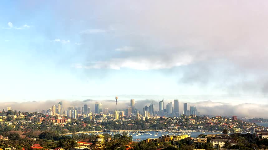 A time lapse of clouds over a city
