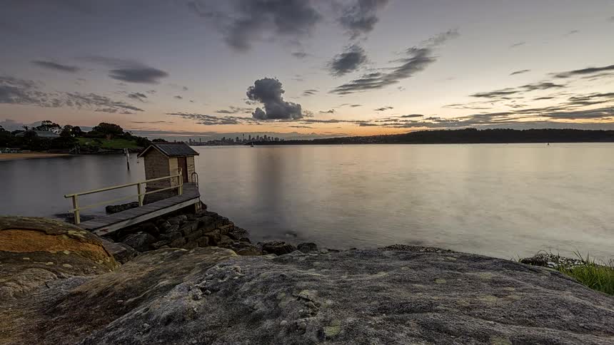 Small wooden pier by the water under an evening sky