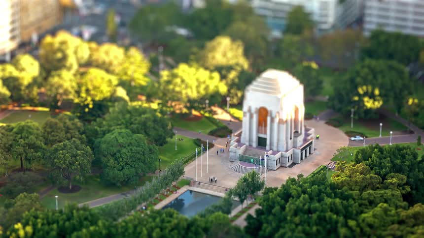 Aerial view of the anzac memorial surrounded by green parkland and pathways in sydney