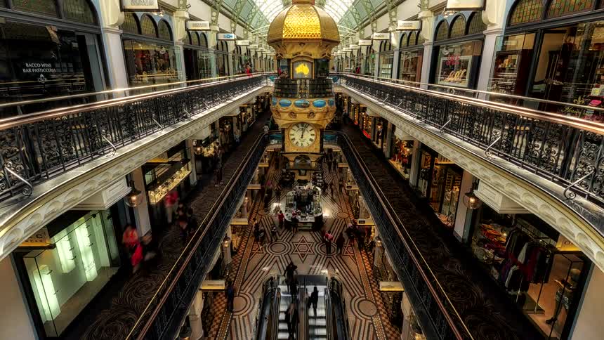 Shoppers move through a multistory shopping mall