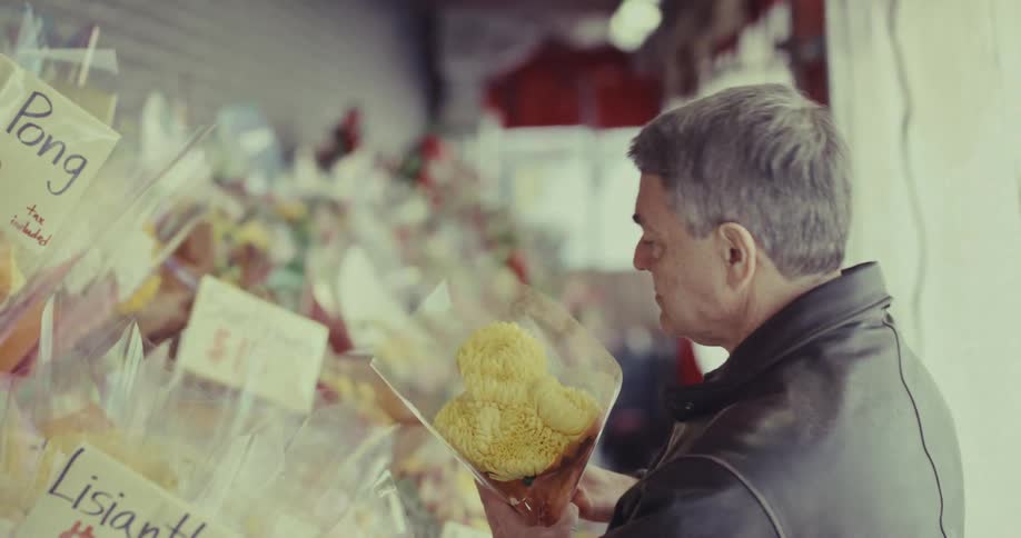 The man is shopping for flowers