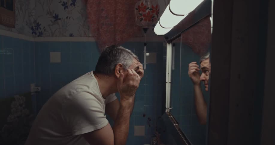 A man checking his hair