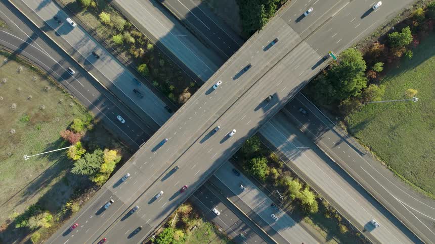 Slow twist above traffic moving on a freeway overpass and underpass interchange