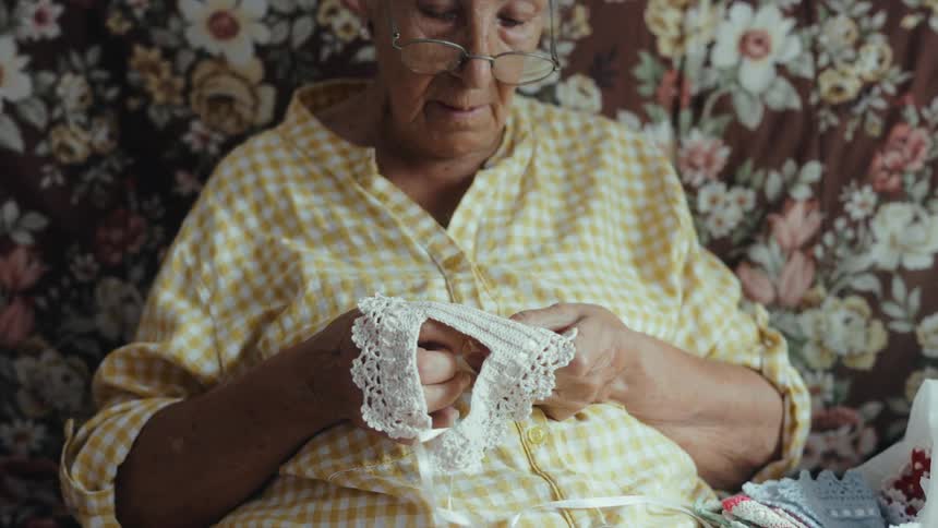 A woman sewing in a room