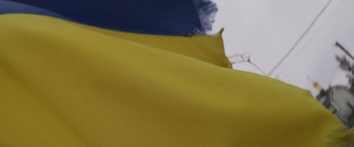 Blue and yellow flag waves in the wind