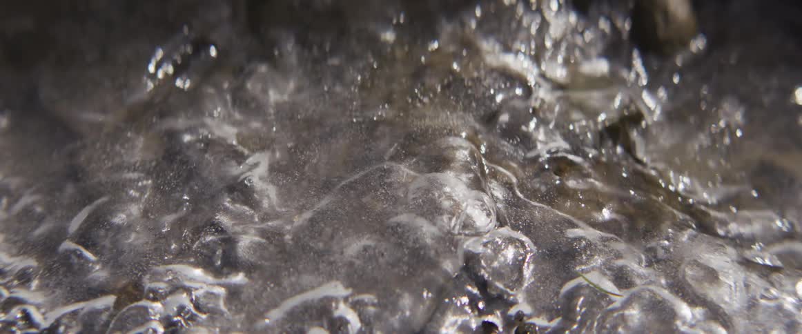 Water bubbling and forming bubbles on liquid surface