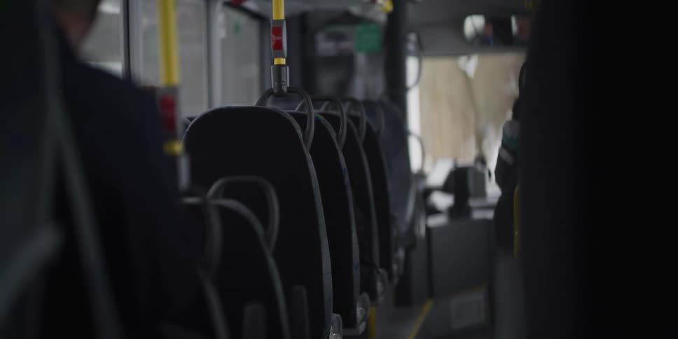 Rows of empty seats inside a bus