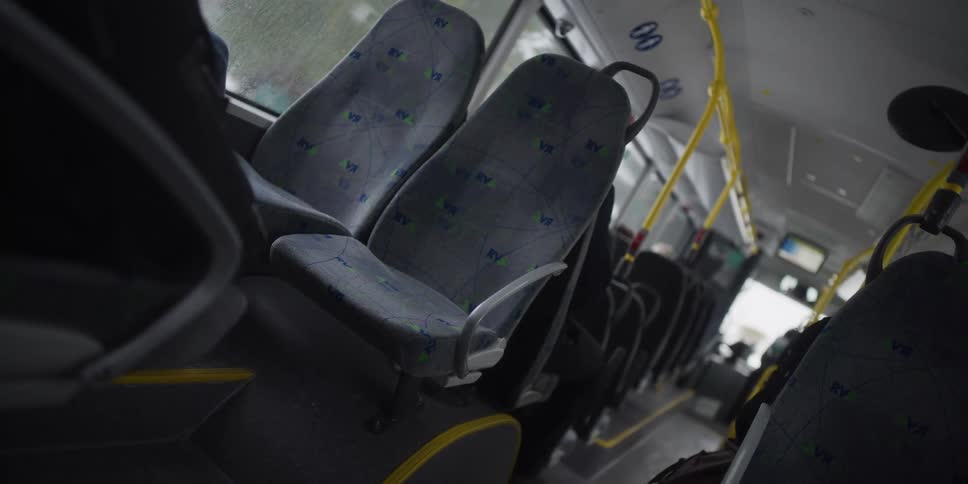 A bus driving down a road