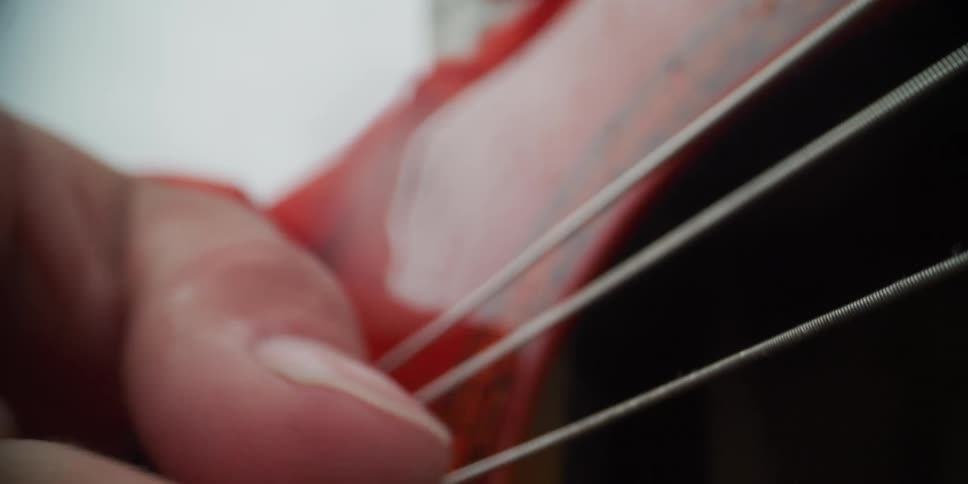 A person playing an acoustic guitar
