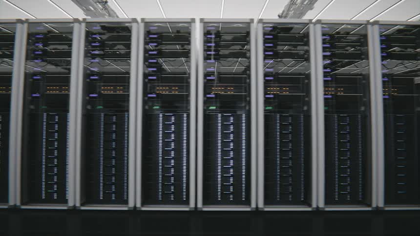 A data center filled with cabinets arranged in rows and columns of powerful computers