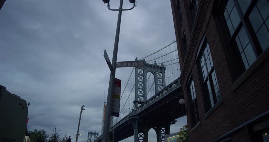 A bridge is at the end of this city block
