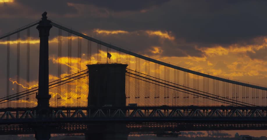 Cars travel on the bridge at dawn