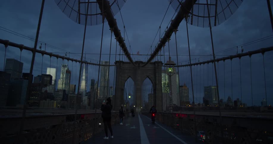The bridge has traffic at dawn towards the city