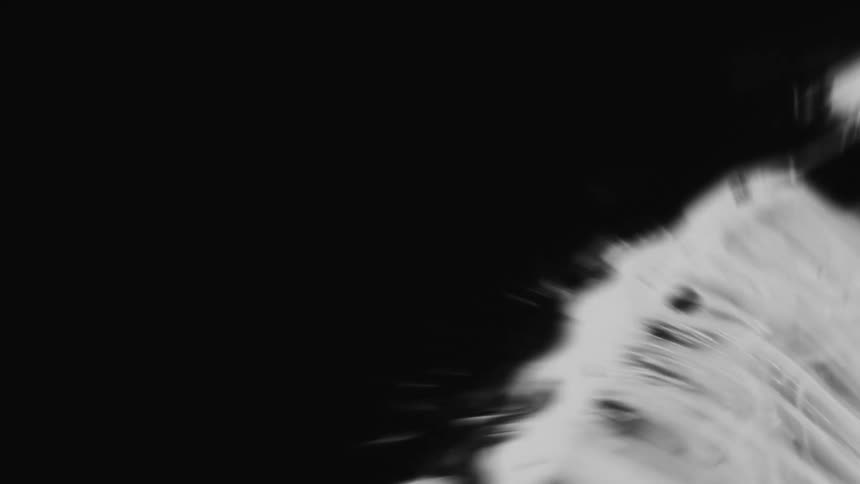 An intense, fast-paced animation of abstract black and white patterns creating a chaotic and energetic visual effect
