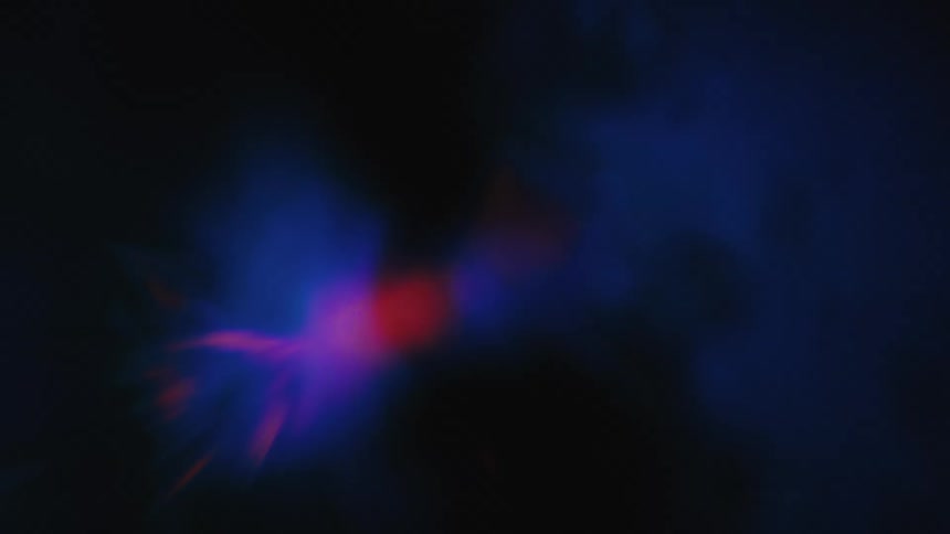 A colorful abstract light effect transforms from a cool blue aura into a brilliant, radiating starburst