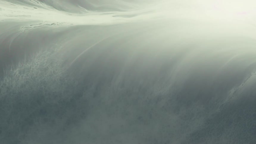 Ethereal white and gray fluids mix together creating a slow-motion, abstract, and otherworldly visual